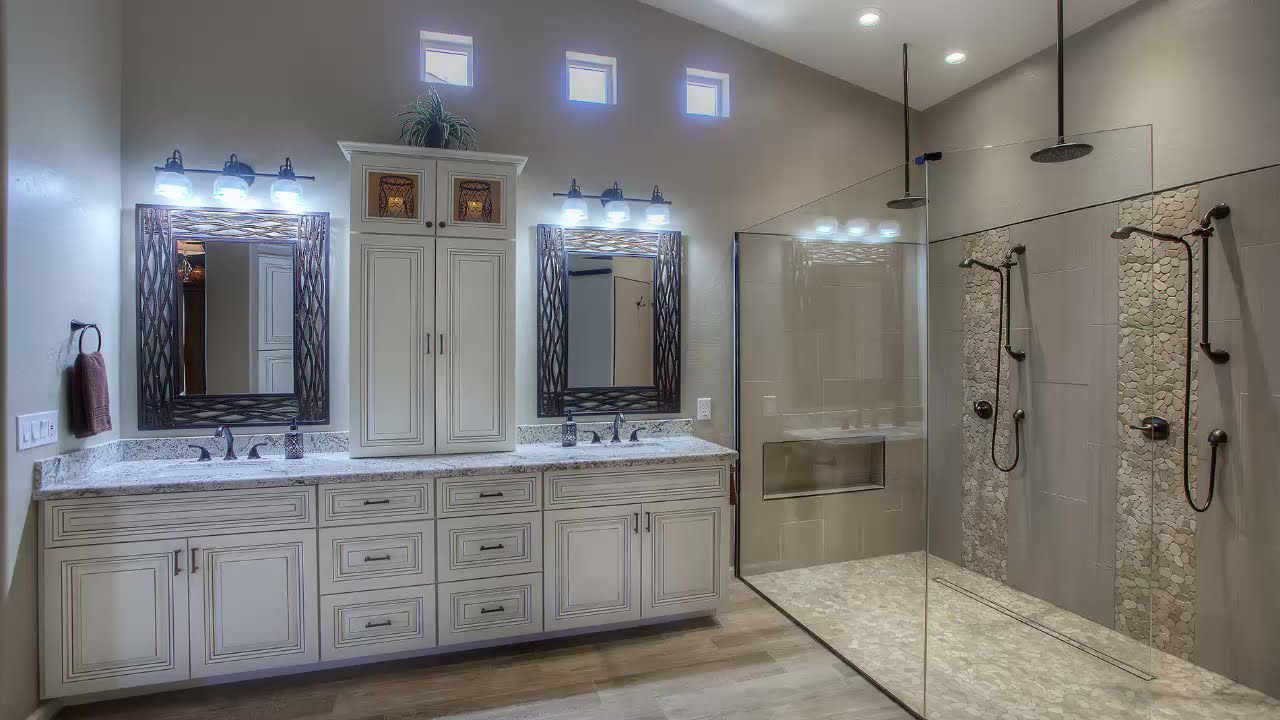 Luxury Bathroom Remodeling Electrical featuring a double vanity, modern LED lighting, frameless glass shower, and elegant custom cabinetry.